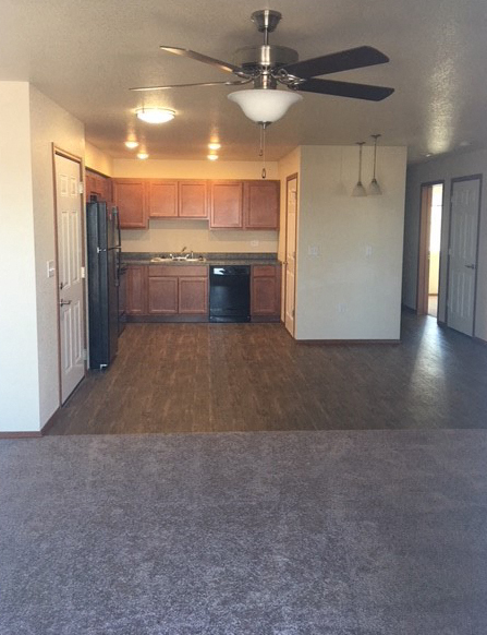 Image of fan, refrigerator, dishwasher, and cabinets